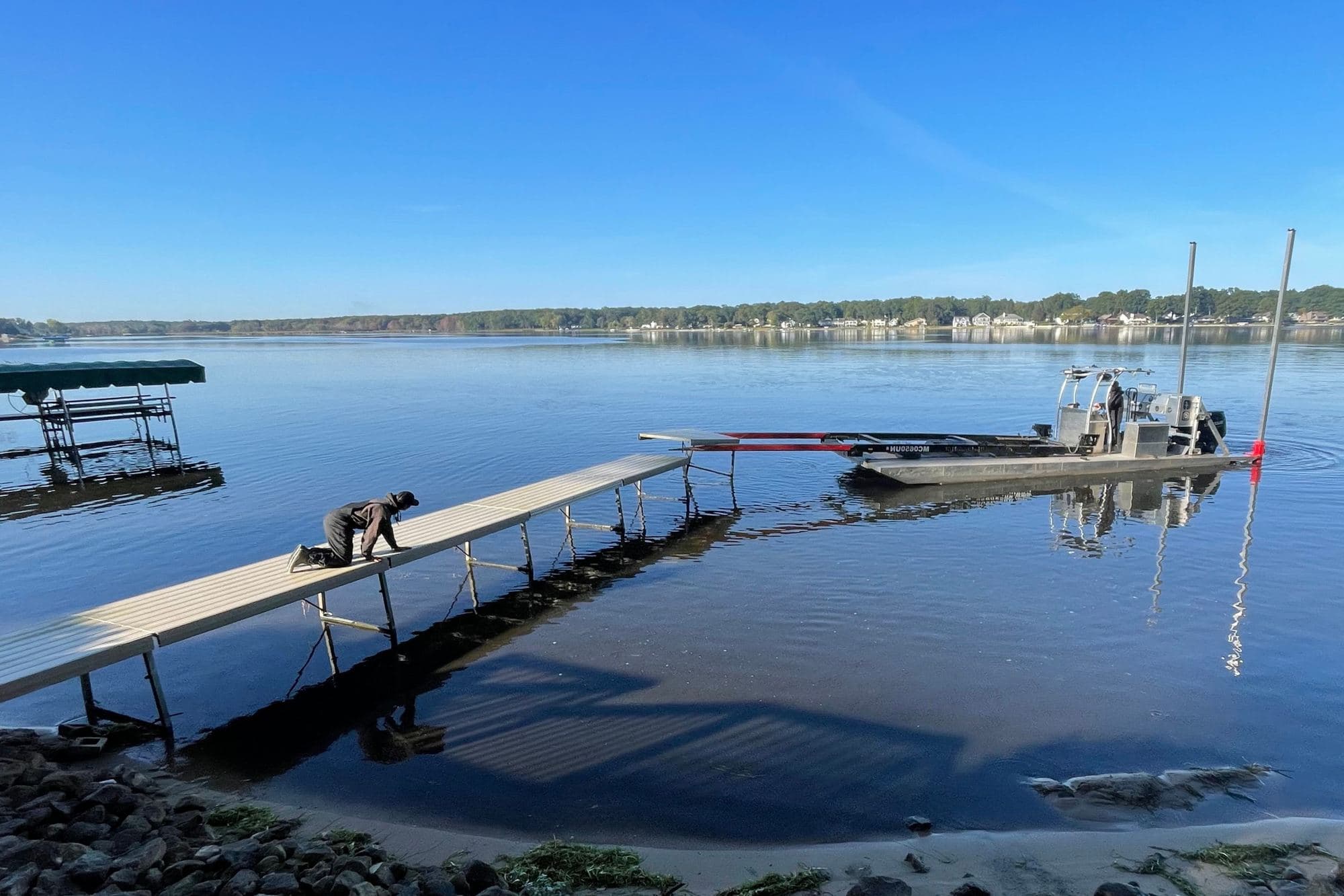 Fresh Coast crew installing a dock from the work barge